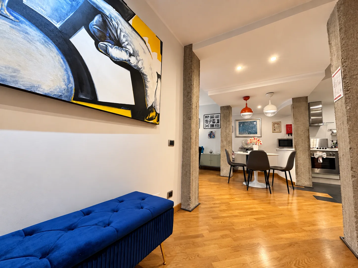 Entrance with blue bench and view of the dining area and kitchen