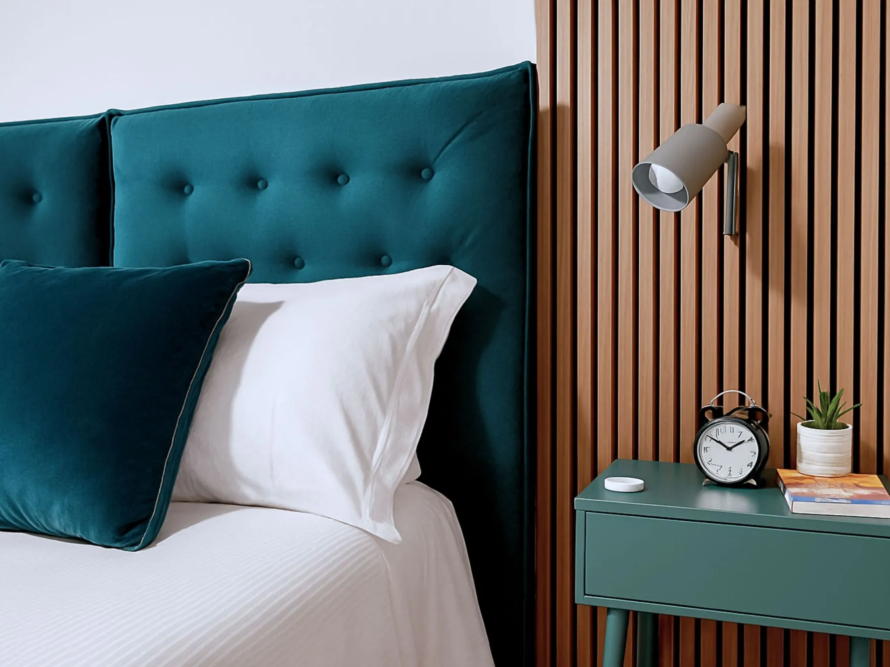 Bedside table with lamp and clock