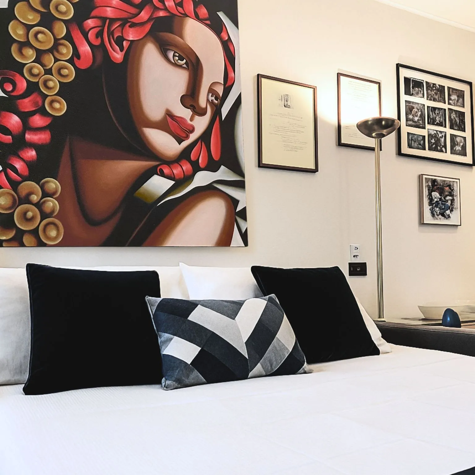 Sofa bed below the Art Deco-style painting