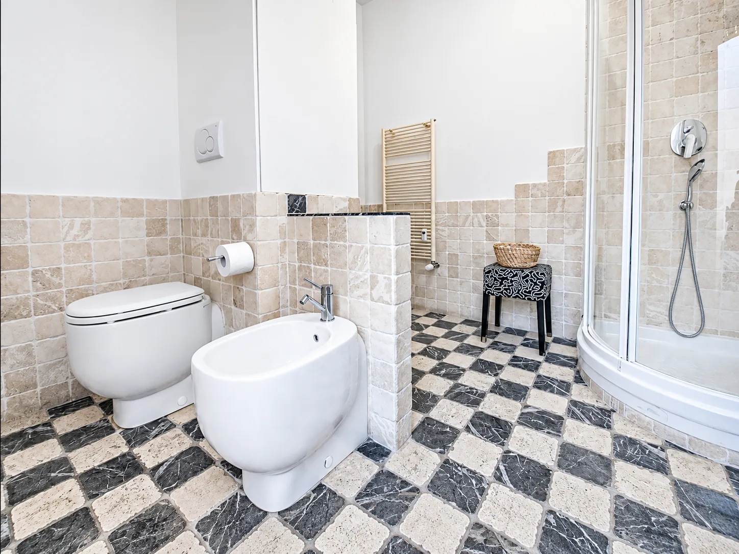 Bathroom with shower cubicle and wall-hung fixtures